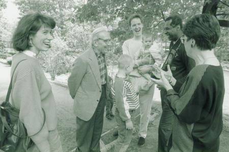 Dr Veselin Kesich smiling in conversation